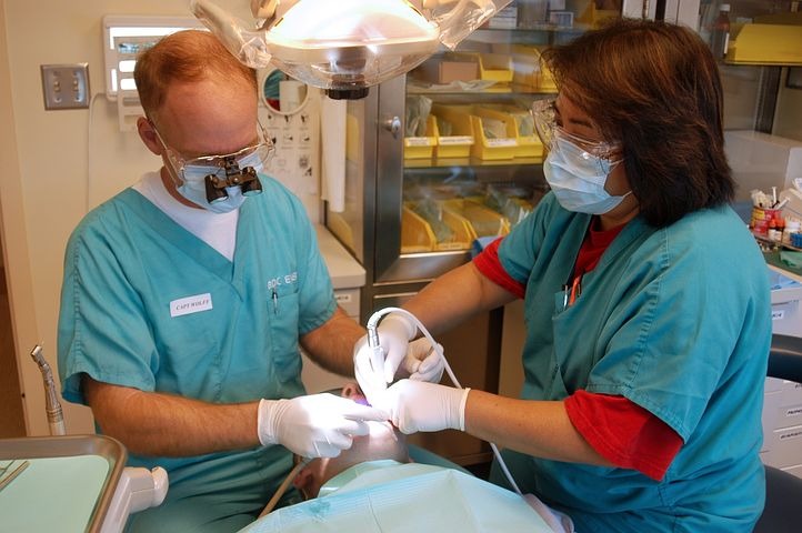Dentist and assistant doing a procedure.